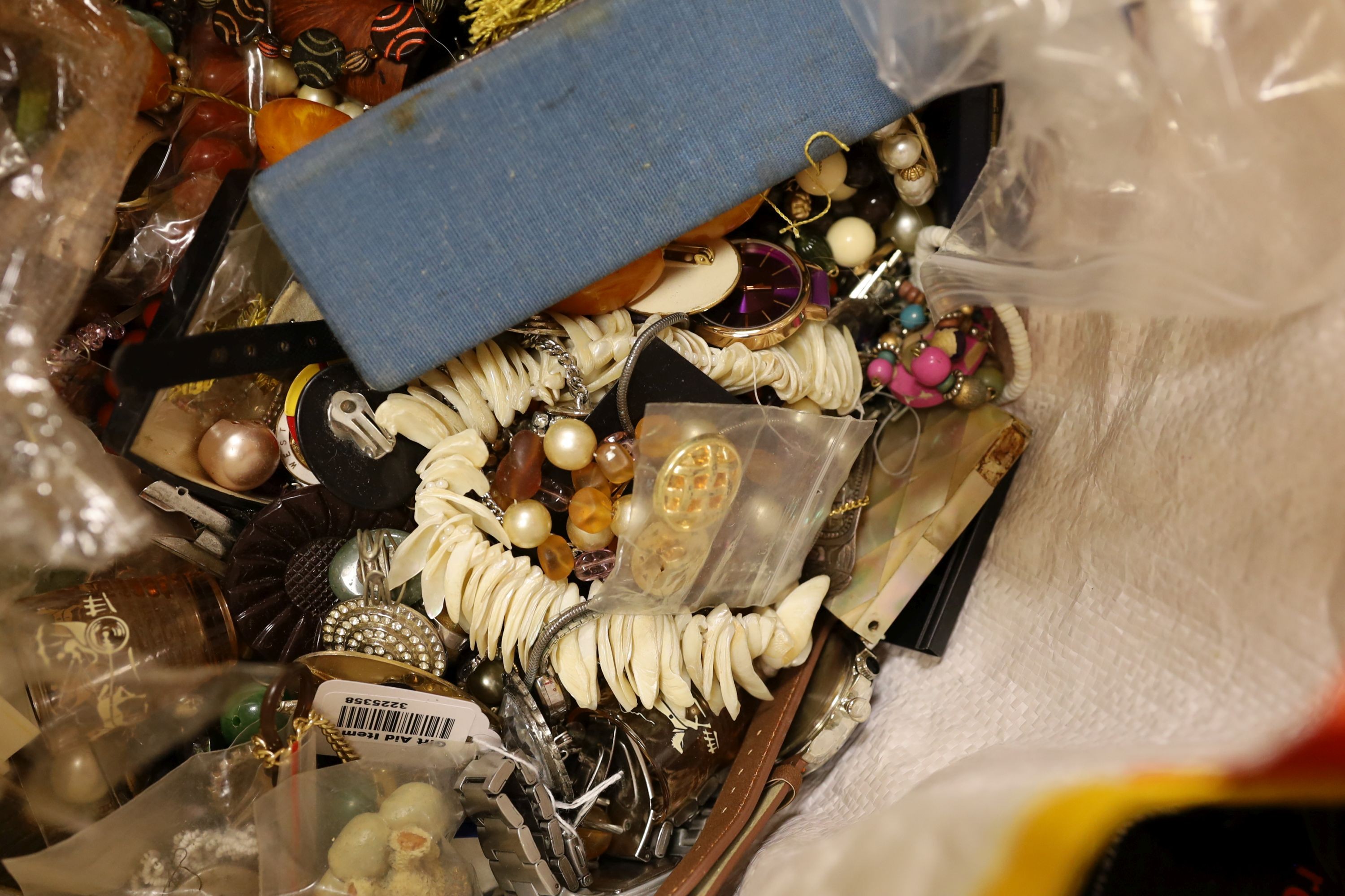 A large quantity of mainly assorted costume jewellery etc. including glass, ceramics and watches.